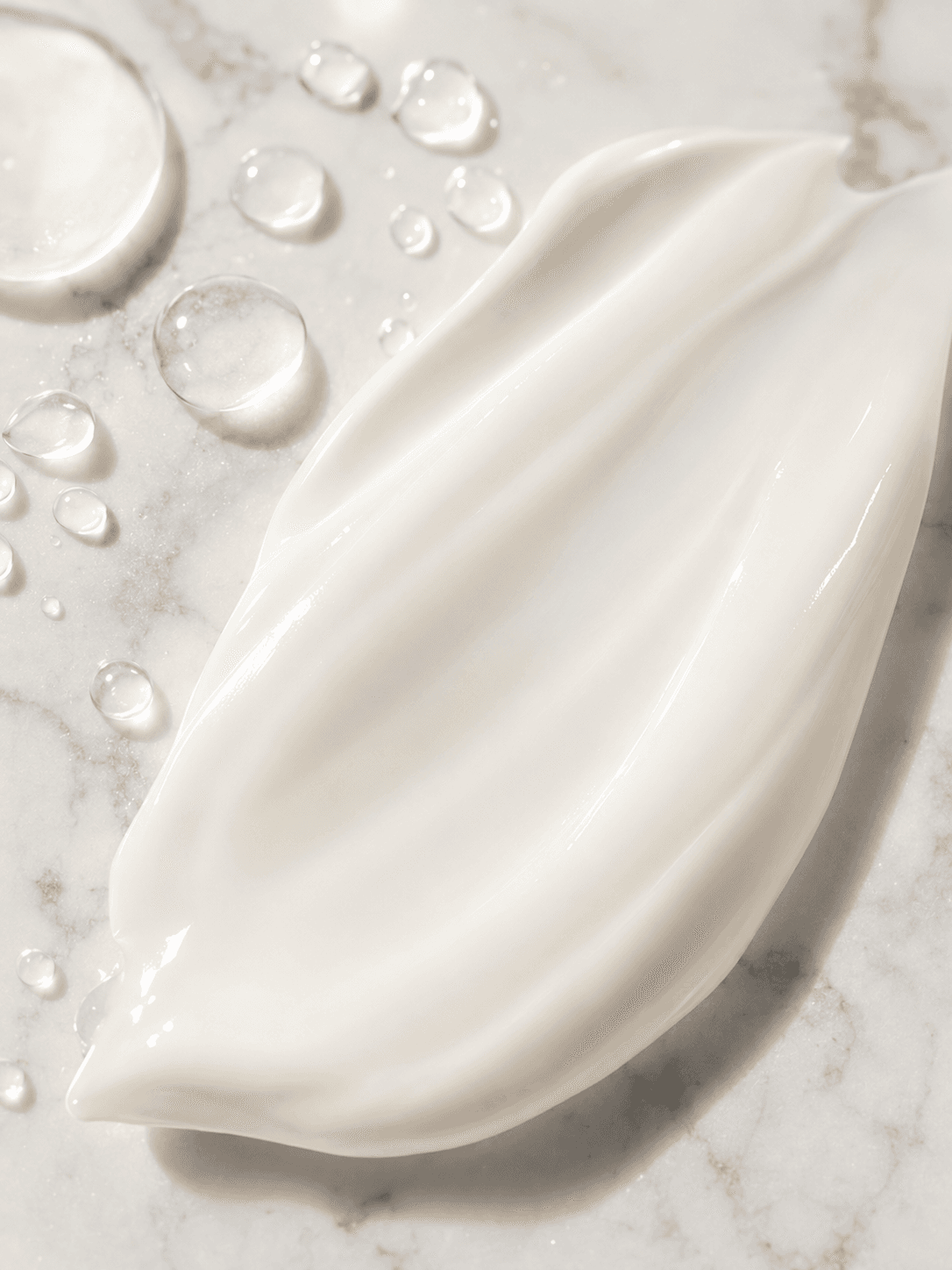 Sunscreen texture on white marble